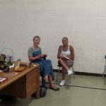 Judi Brook and a volunteer in the old auditorium.