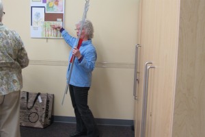 Carol Heikema installing her student's show